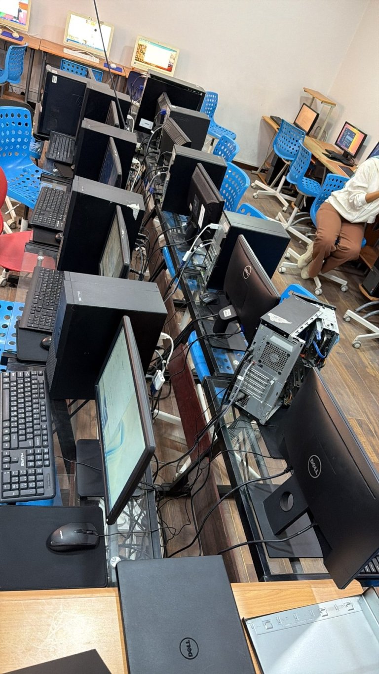 Desktop PC opened for dust cleaning and servicing in a school computer lab in Bahrain